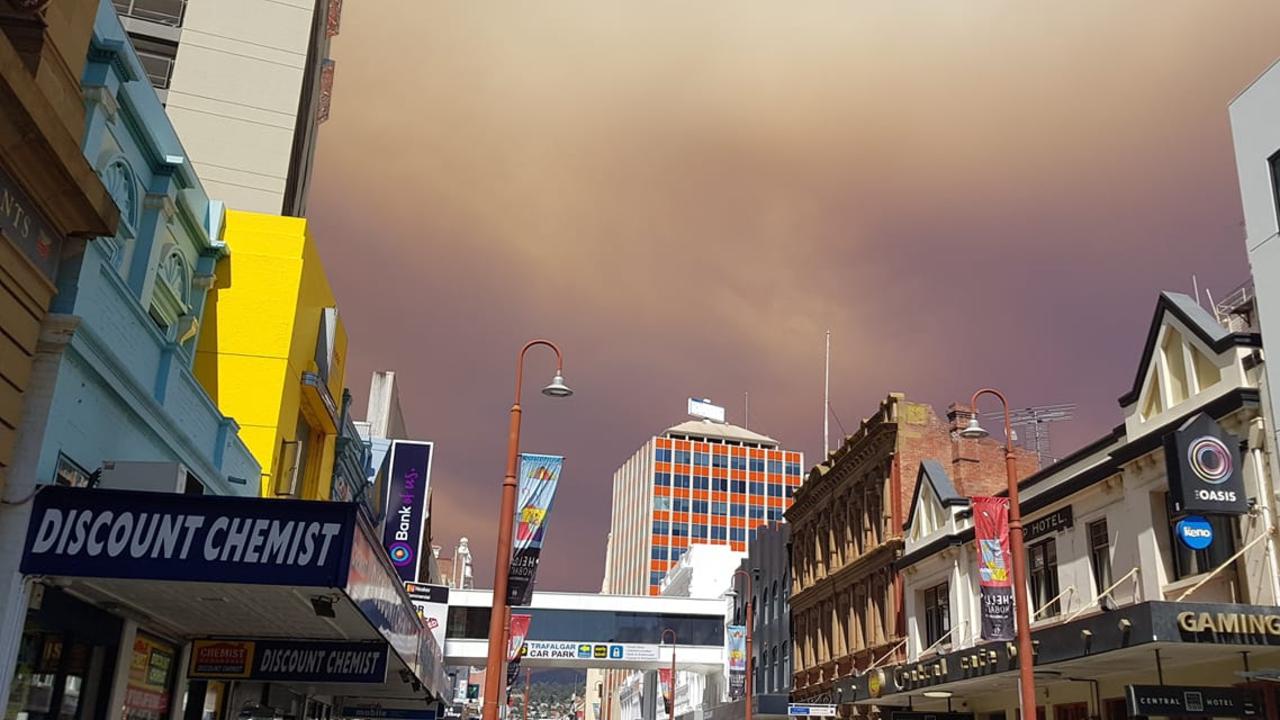 Smoke seen above Collins Street, Hobart from the fires burning out of control in the state’s South West. Picture: JENN HARRIS