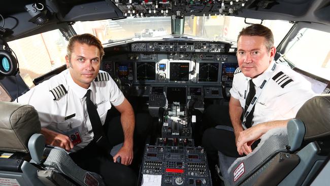 Virgin Australia pilots Kyle Haafkens (left) and Adam Turner on the day the company announced it has gone into administration due to COVID-19. Picture: Aaron Francis/