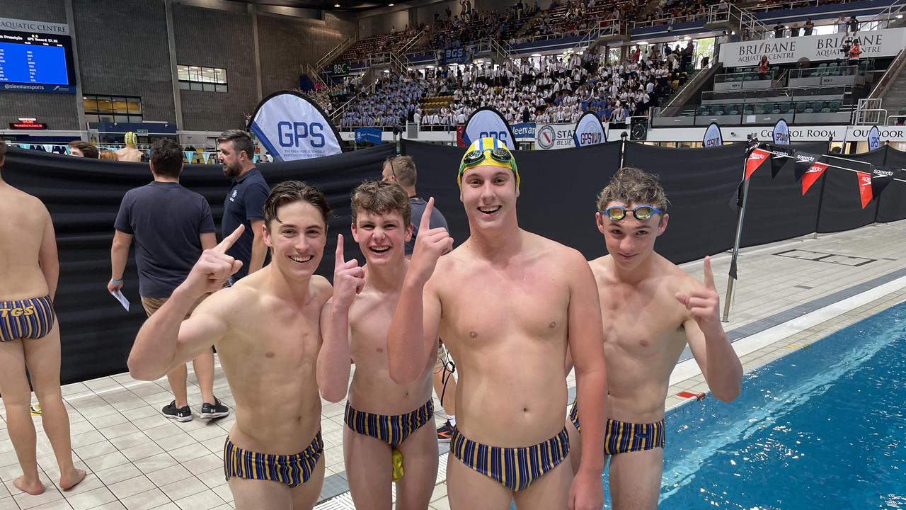 Toowoomba Grammar School's Ryan Thorton, yellow cap, celebrates his win with school mates.