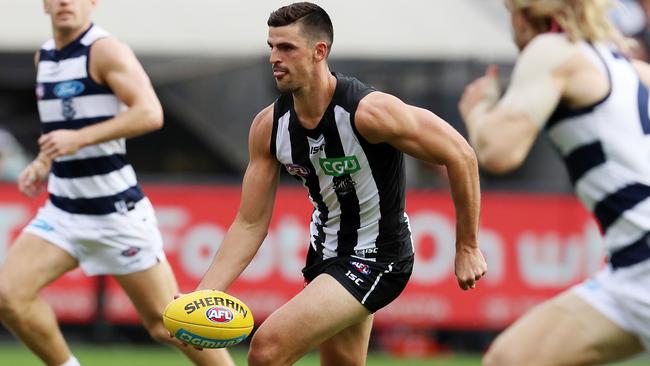 Scott Pendlebury fires off a handball against Geelong. Picture: Michael Klein