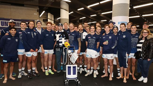 The team embraces Angus, assembling for a group photo before the game. Picture: Michael Klein.