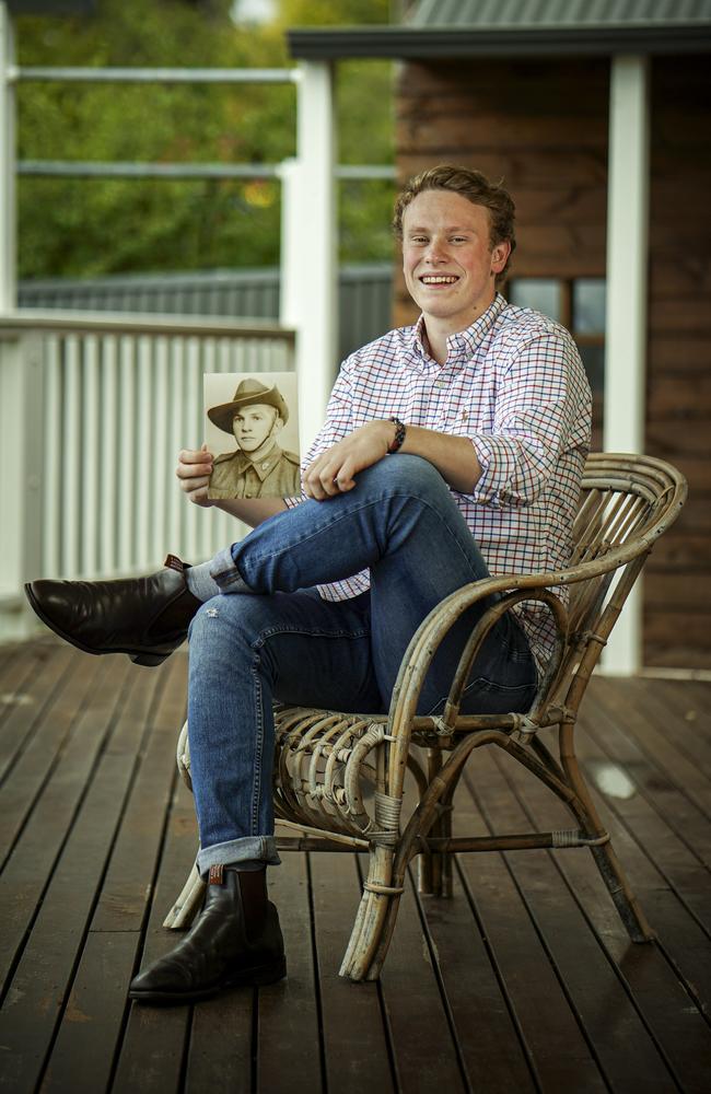 Ned Young holding a pic of his World War II veteran great-grandfather Max Hudson. Picture: AAP / Mike Burton