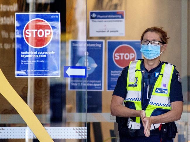 MELBOURNE, AUSTRALIA - NewsWire Photos December 13 2020: Police at the Novotel Hotel in South Wharf on Sunday morning. The Novotel is one of the hotspot  hotels designated for quarantining positive Covid cases in Melbourne. Picture: NCA NewsWire / David Geraghty