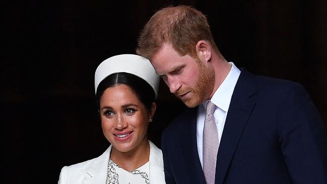 (FILES) In this file photo taken on March 11, 2019 Britain's Prince Harry, Duke of Sussex (R) and Meghan, Duchess of Sussex leave after attending a Commonwealth Day Service at Westminster Abbey in central London. - Prince Harry will produce a documentary about the Invictus Games for disabled military veterans -- the first series under a lucrative deal he and  wife Meghan Markle signed with Netflix after moving to California last year.  Harry, who served with the British military in Afghanistan, will appear on camera and executive-produce "Heart of Invictus," a multi-episode series which follows competitors as they train for next spring's competition in The Hague. (Photo by Ben STANSALL / AFP)