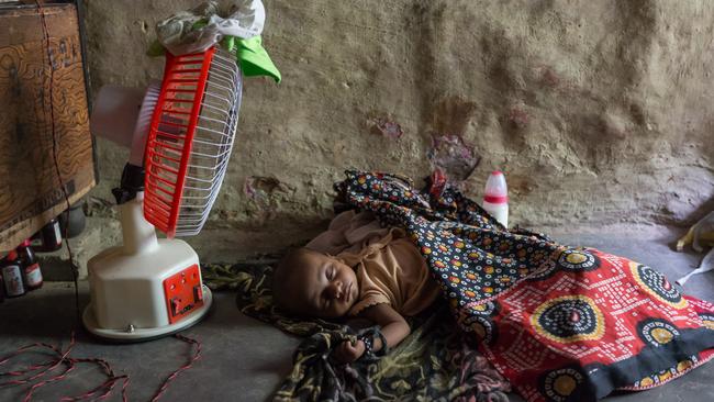 Off-grid solar offers enough power to keep a lightbulb or fan going in a New Delhi slum. Picture: Graham Crouch