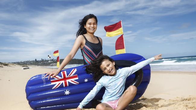 Shruti Khandai and Aditi Khandai, at South Curl Curl Beach, are among the growing number of us looking forward to celebrating Australia Day. Picture: Richard Dobson