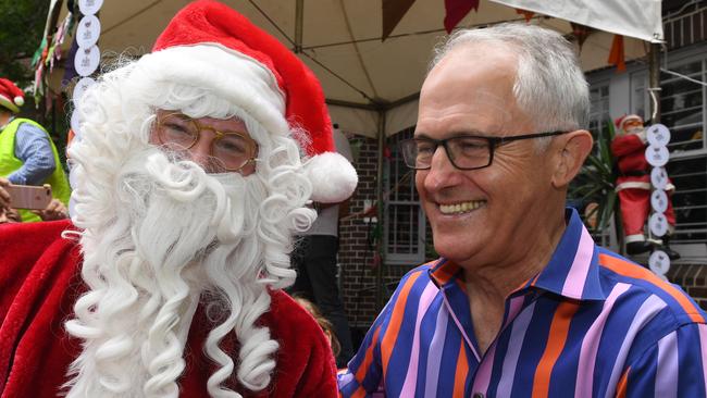 Malcolm Turnbull meets Santa during the annual Wayside Chapel Christmas lunch and street party in Kings Cross last year.