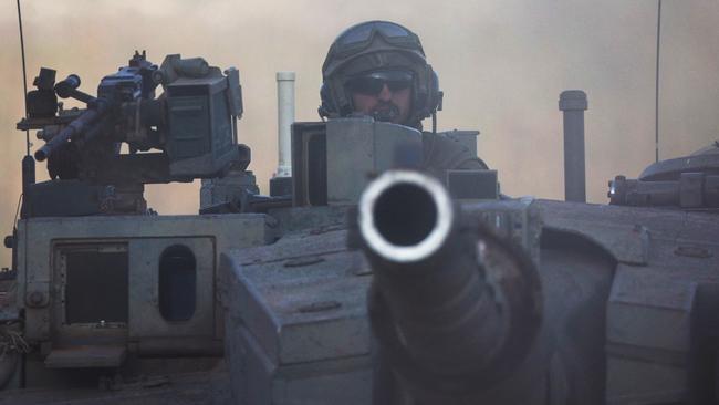 An Israeli tank during drills near the northern border with Lebanon on Friday (AEDT). Picture: Reuters