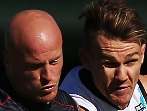 ALICE SPRINGS, AUSTRALIA - MAY 31: Nathan Jones (L) of the Demons and Robbie Gray of the Power compete for the ball during the round 11 AFL match between the Melbourne Demons and the Port Power at Traeger Park on May 31, 2014 in Alice Springs, Australia. (Photo by Michael Dodge/Getty Images)