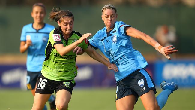 Karly Roestbakken of Canberra and Alanna Kennedy of Sydney FC compete for the ball in the W-League.