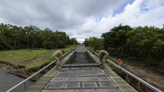 Australian Army soldiers from the 3rd Combat Engineer Regiment assemble a Medium Girder Bridge at Ollera Creek.