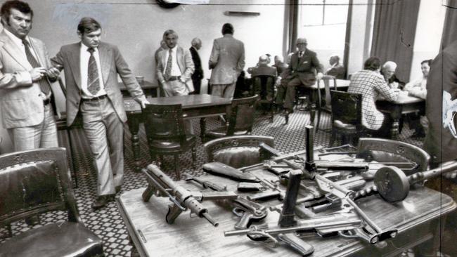 Police in the Victoria Club in Queen St display the guns used in the Great Bookie Robbery.