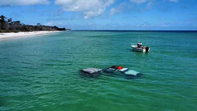 Incredible photos show a massive towing operation to recover a Jeep and camper trailer from the depths just off the shores of K’gari (Fraser Island) over the weekend. Picture: Fraser Island Towing