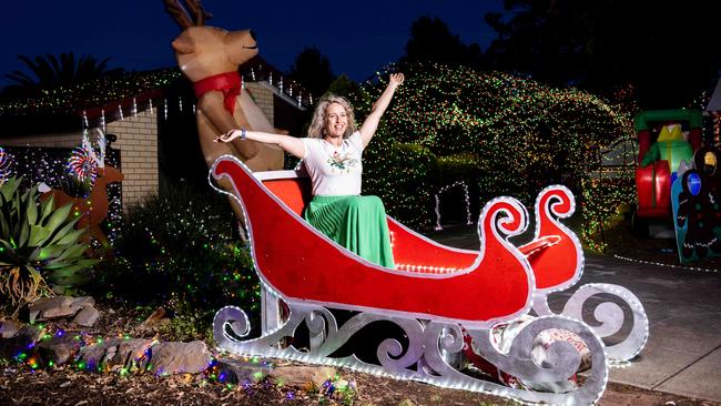 Janelle Neave with her Christmas lights display at her Surrey Downs home and raising money for a local primary school. Picture: Kelly Barnes