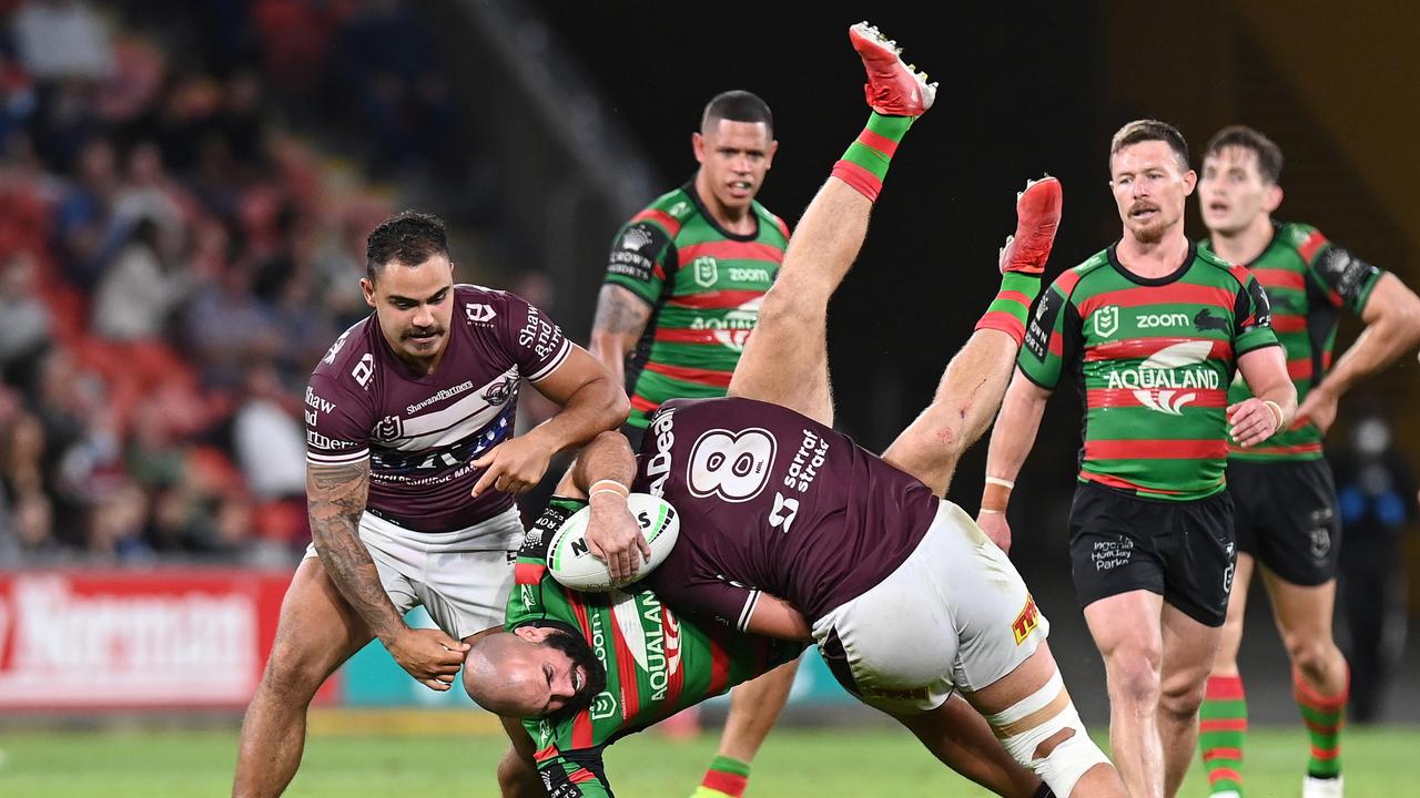 BRISBANE, AUSTRALIA - SEPTEMBER 24: Mark Nicholls of the Rabbitohs is tackled by Josh Aloiai of the Sea Eagles during the NRL Preliminary Final match between the South Sydney Rabbitohs and the Manly Sea Eagles at Suncorp Stadium on September 24, 2021 in Brisbane, Australia. (Photo by Bradley Kanaris/Getty Images)