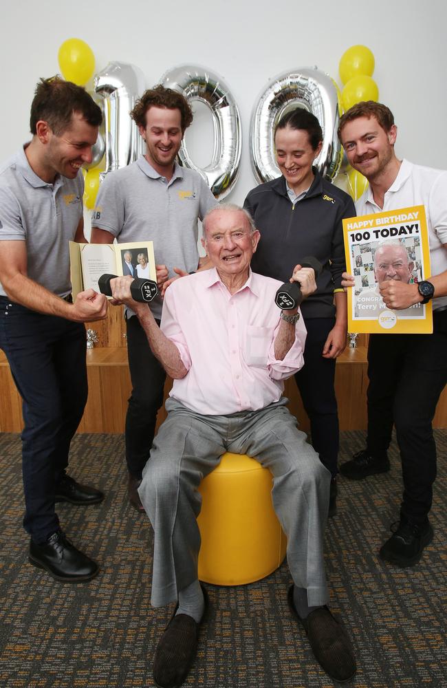 Terry McMahon with Fitness Lab trainers Jake Sheridan, Will Paatsch, Sydney Arnold and Tom Collins for his 100th birthday. Picture: Alan Barber.