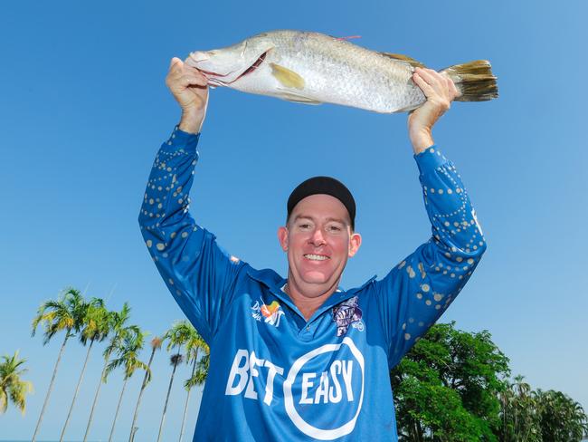 Jamie McGuiness with his tagged Barra caught at King Ash Bay. Picture GLENN CAMPBELL