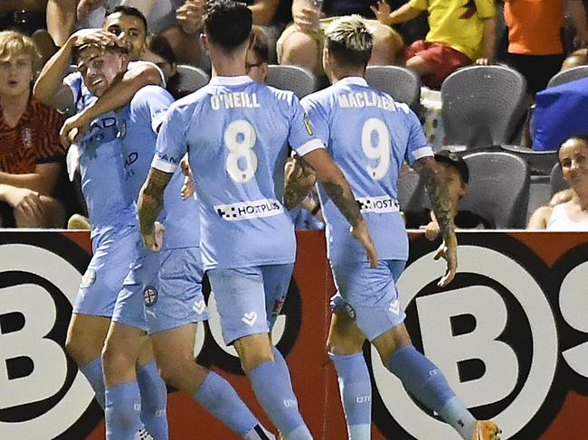 BRISBANE, AUSTRALIA - DECEMBER 29: Connor Metcalfe of Melbourne City celebrates with team mates after scoring a goal during the A-League match between the Brisbane Roar and Melbourne City at Dolphin Stadium, on December 29, 2020, in Brisbane, Australia. (Photo by Albert Perez/Getty Images)