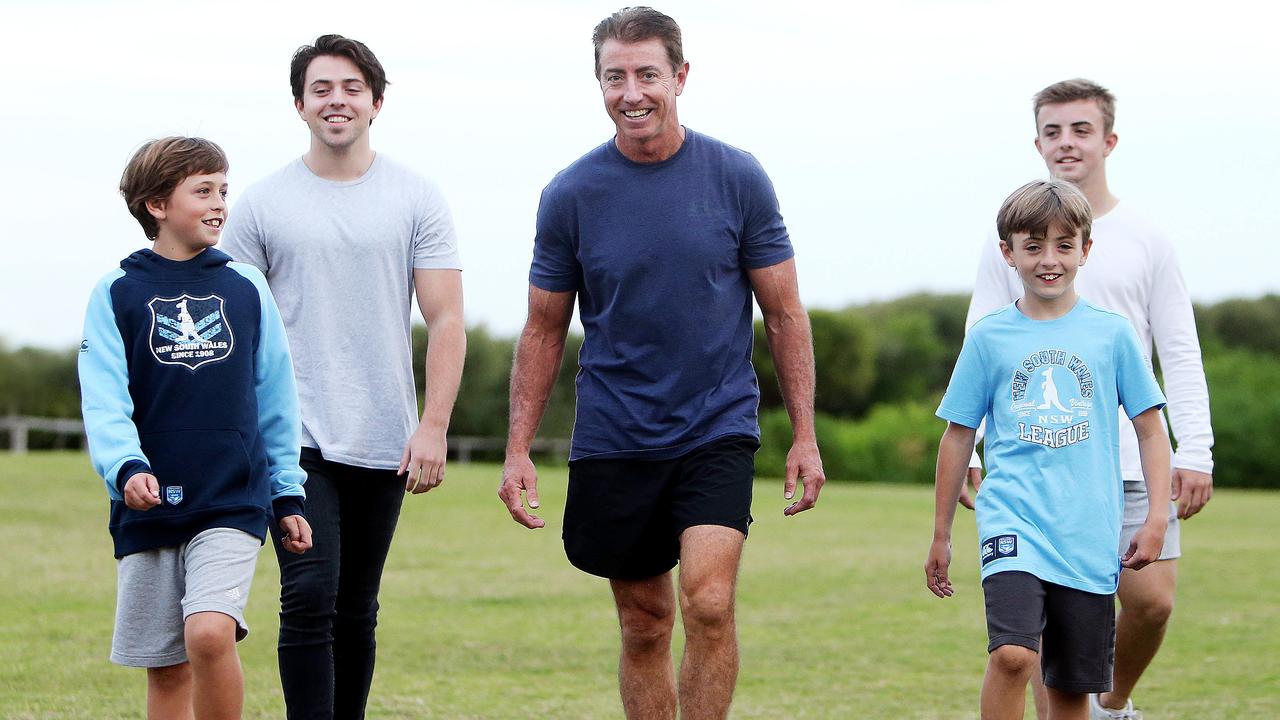 Greg Alexander with his kids. His son Braith will join the Roosters on a one-year contract next year. Picture: Tim Hunter