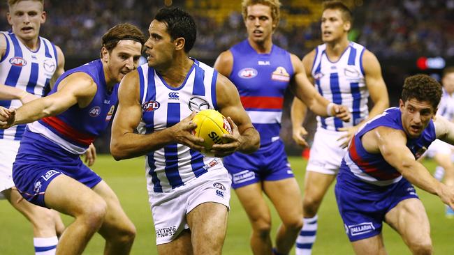 Daniel Wells evades Marcus Bontempelli and Tom Liberatore the last time the Roos and Dogs clashed. Picture: Wayne Ludbey