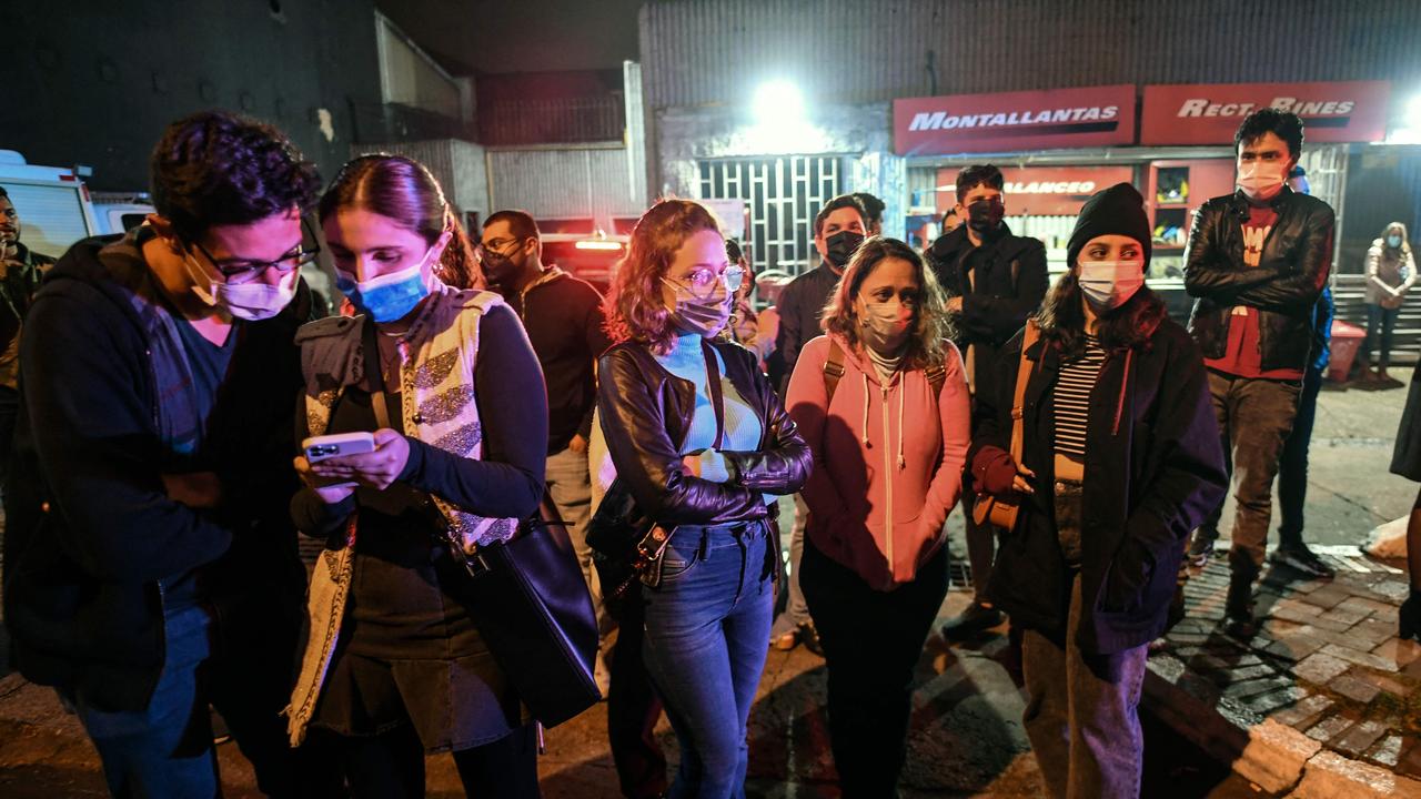 People gather in front of a hotel where Foo Fighters' drummer Taylor Hawkins died. Picture: AFP