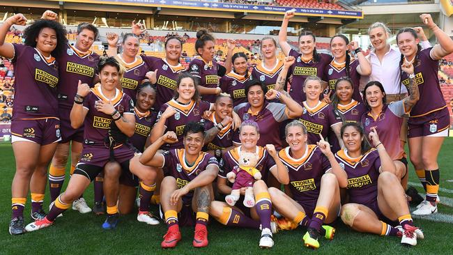 Broncos players celebrate following their trial match against PNG Orchids. Picture: AAP