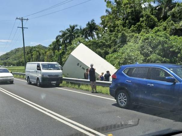 Emergency crews were called to the Captain Cook Highway at Kewarra adjacent to the Paradise Palms Golf Course after a truck left the road and drove into an embankment trapping the driver. Photo: Facebook