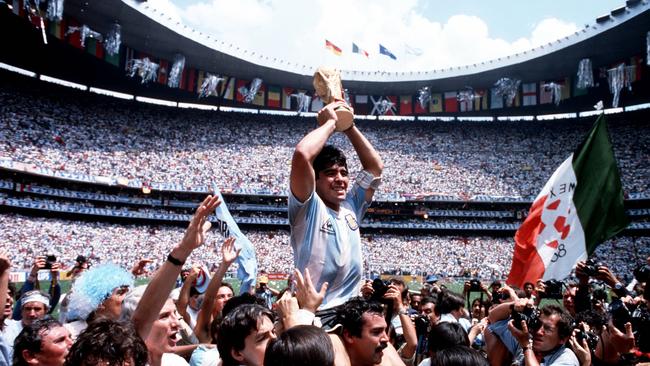 Argentina Captain Diego Maradona holds the World Cup trophy in 1986.S