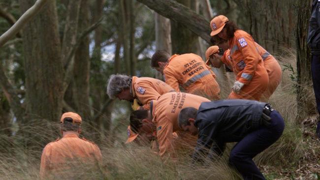 SES volunteers search the Mount Buninyong scene where the body of Belinda Williams was found.