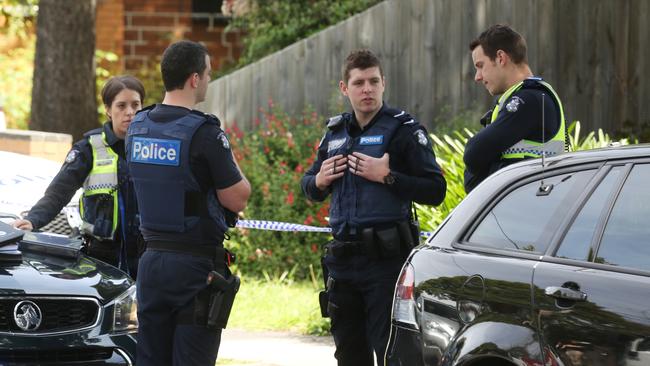 Police outside the Mitcham property after the death. Picture: Stuart Milligan