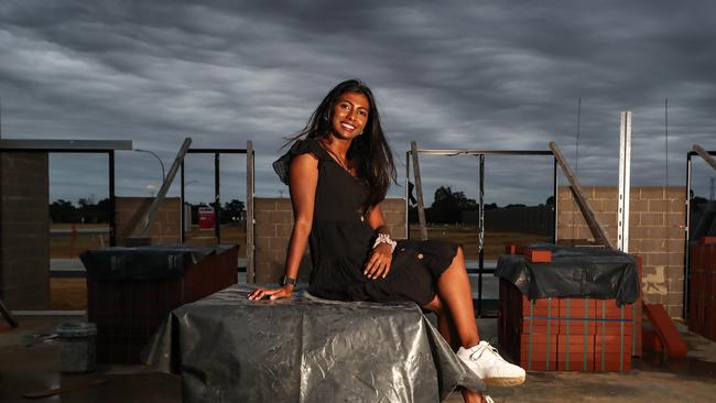 Keziah Solomon, 22, at the West Australian construction site she help fund wiht the HomeBuilder stimulus. Picture: Colin Murty