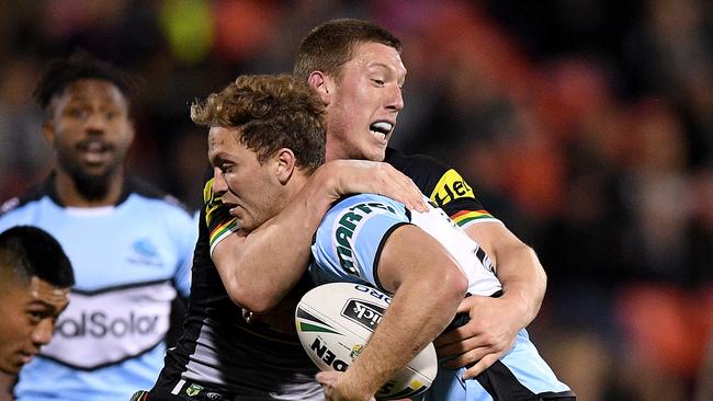 Matt Moylan of the Sharks is tackled by Jack Hetherington of the Panthers during the Round 18 NRL match between the Penrith Panthers and the Cronulla-Sutherland Sharks at Panthers Stadium in Sydney, Friday, July 13, 2018. (AAP Image/Dan Himbrechts) NO ARCHIVING, EDITORIAL USE ONLY