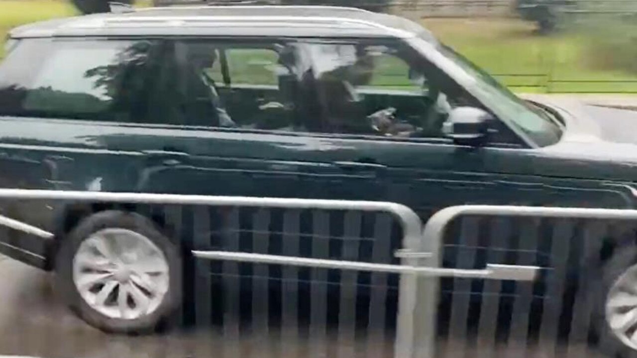 Prince Harry is spotted leaving Balmoral Castle in a black range rover.