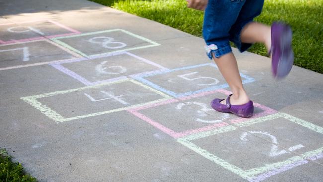 Draw a hopscotch pattern making sure the boxes are big enough to fit everyone’s feet and are numbered.