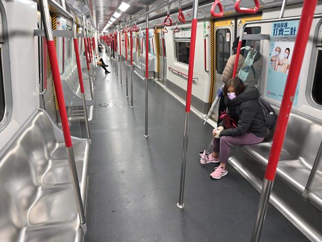 An almost empty MTR train is seen in Hong Kong on February 22, 2022, as the city faces its worst Covid-19 coronavirus wave to date. (Photo by Peter PARKS / AFP)