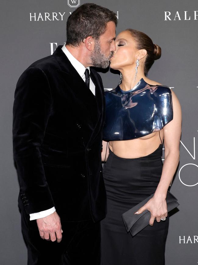 A little PDA from the couple on the red carpet. Picture: Kevin Winter/Getty Images