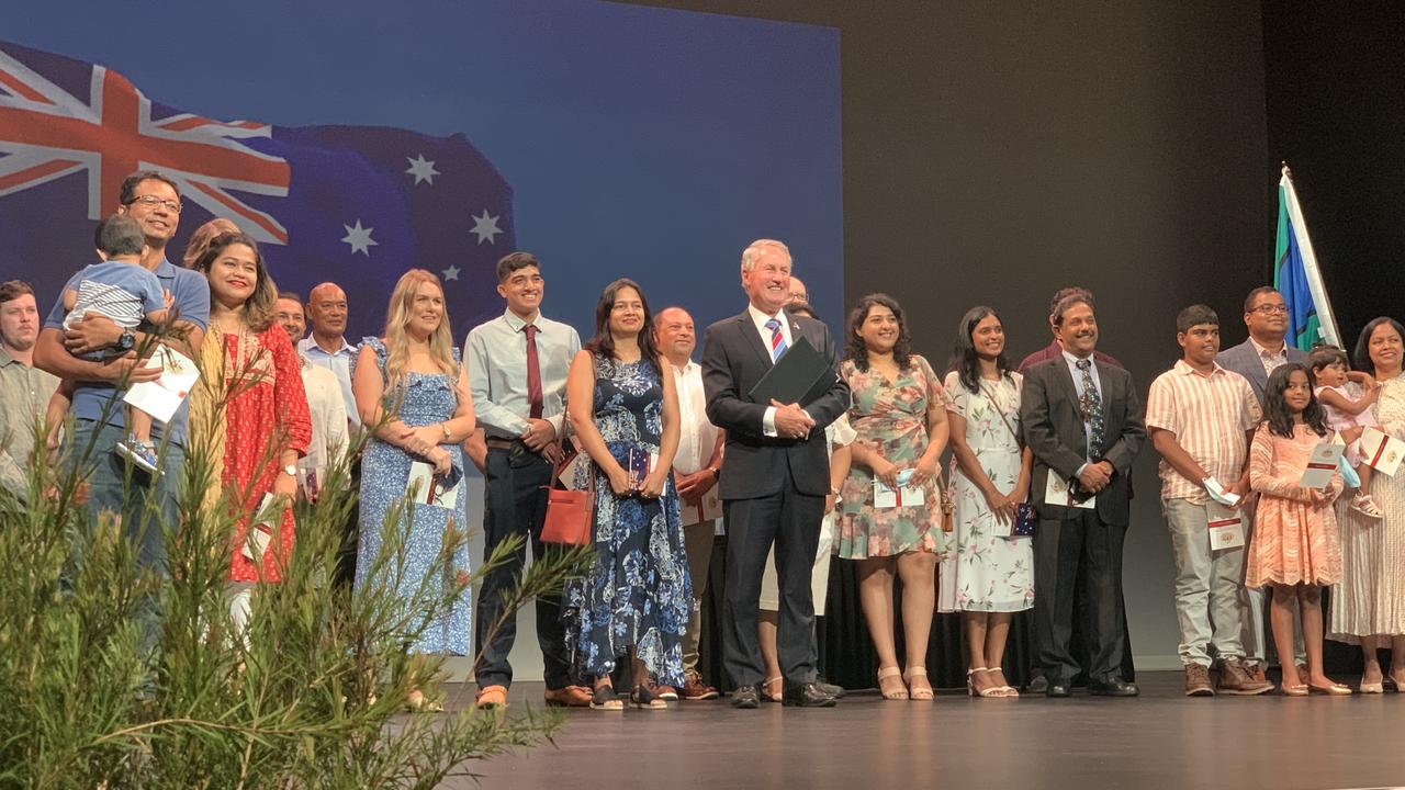 Mackay Mayor Greg Williamson stands with new Australians at the MECC on Australia Day. Mr Williamson read out the affirmation and oath and the new citizens repeated the words, confirming their new citizenship. Wednesday, January 26, 2022. Mackay Australia Day 2022. Mackay Citizenship Ceremony 2022. Picture: Duncan Evans