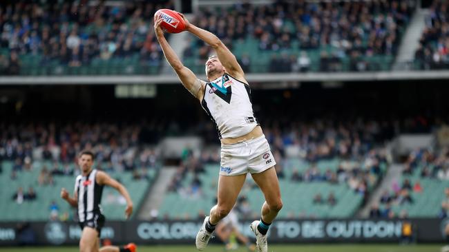 Travis Boak at full stretch against Collingwood. Picture: Michael Willson/AFL Media/Getty Images