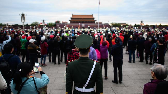 Thirty years after the crackdown on Tiananmen protesters, the tanks have been replaced by countless surveillance cameras perched to keep the population in check. Picture: STR/AFP)