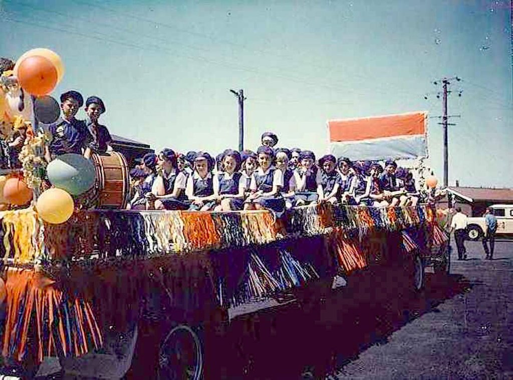 FLASHBACK: This is the Rangeville State School band preparing to leave the start yard for the Carnival of Flowers parade in late 1960. The little fellow standing up in the middle of the group is Mitch Rudd. His sister Tracy and his cousins, the Hammond family, participated in the Rangeville band for a number of years.