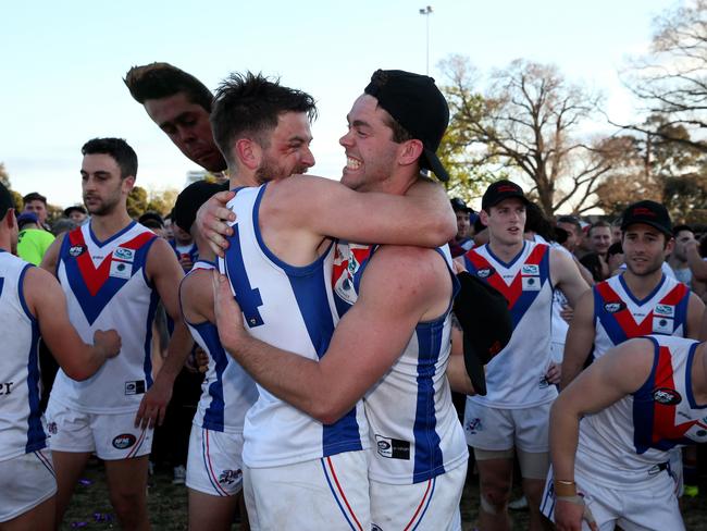 West Preston-Lakeside players soak up the spoils of their grand final success. 