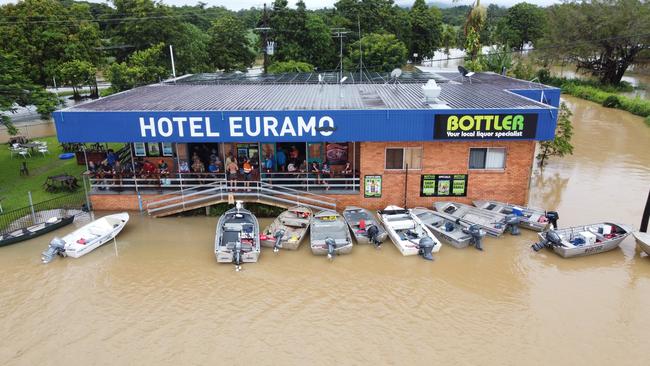 Flooding at the Euramo Hotel with locals travelling by boat for a drink. Picture: Tori Muzic