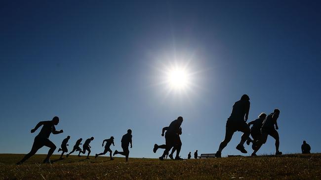Wallabies players run during a July hills training session in Sydney.