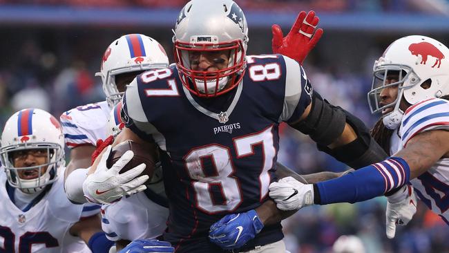 Rob Gronkowski #87 of the New England Patriots runs for extra yards.