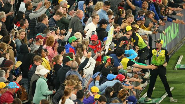 Molly Strano climbs into the crowd after the big Aussie success.