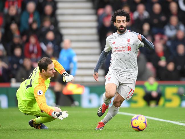 ***BESTPIX*** BOURNEMOUTH, ENGLAND - DECEMBER 08:  Mohamed Salah of Liverpool goes past Asmir Begovic of AFC Bournemouth and goes onto to score his sides his hatrick and his sides fouth goal during the Premier League match between AFC Bournemouth and Liverpool FC at Vitality Stadium on December 8, 2018 in Bournemouth, United Kingdom.  (Photo by Mike Hewitt/Getty Images)