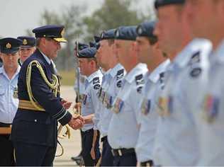 COUNTRY’S HONOUR: Chief of Air Force, Air Marshal Geoff Brown, presents combat badges to members of the Multi-National Base Command - Tarin Kot and Security Force at the welcome home parade. Picture: LAC Brenton Kwaterski