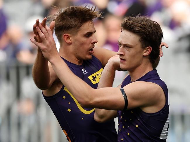 PERTH, AUSTRALIA - JULY 21: Jye Amiss of the Dockers celebrates a goal with teammates during the 2024 AFL Round 19 match between the Fremantle Dockers and the Melbourne Demons at Optus Stadium on July 21, 2024 in Perth, Australia. (Photo by Will Russell/AFL Photos via Getty Images)