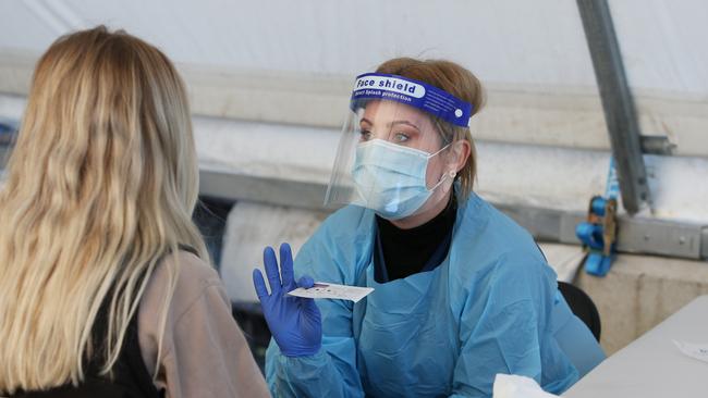 Pathology Collector, conducts a COVID-19 swab test at the Rushcutters Bay mobile Covid testing clinic on June 25, 2021. (Photo by Lisa Maree Williams/Getty Images)