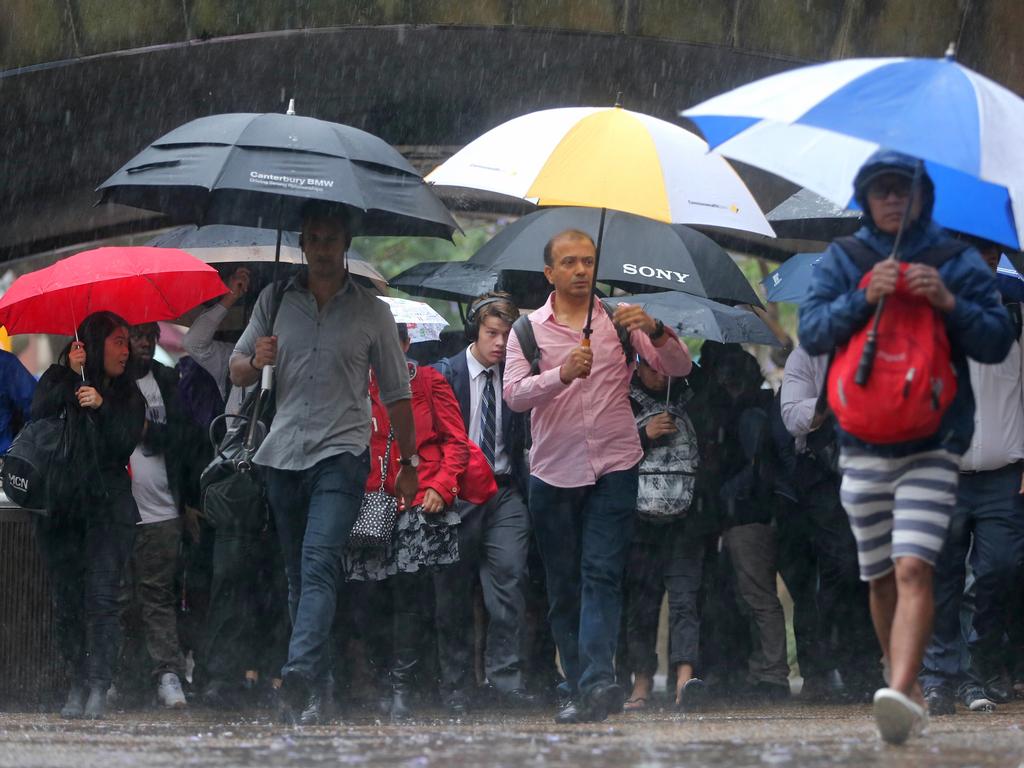 As The low hits Sydney people around town hall .picture John Grainger